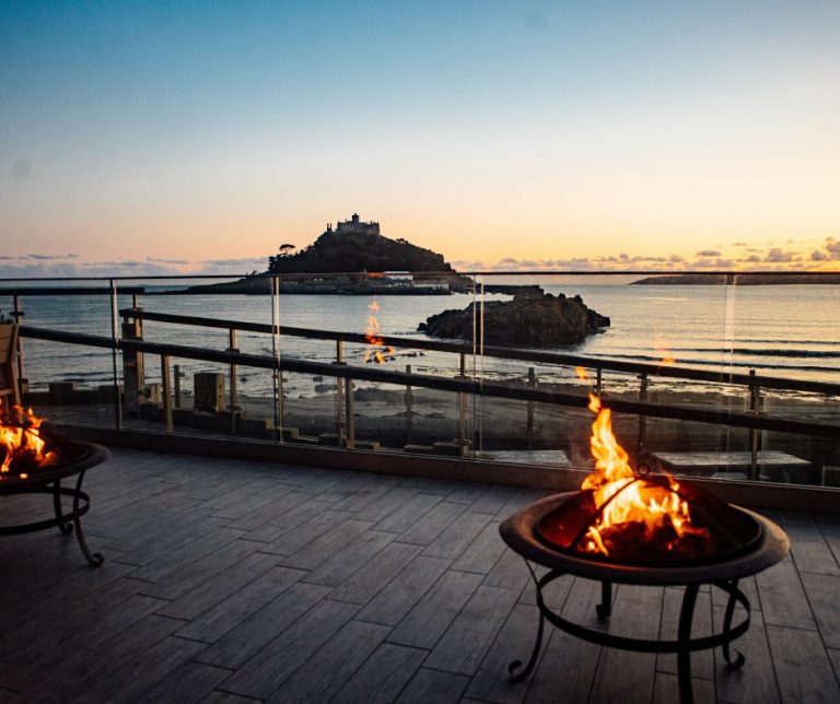 The outside seating area at The Godolphin, overlooking St Michael's Mount.